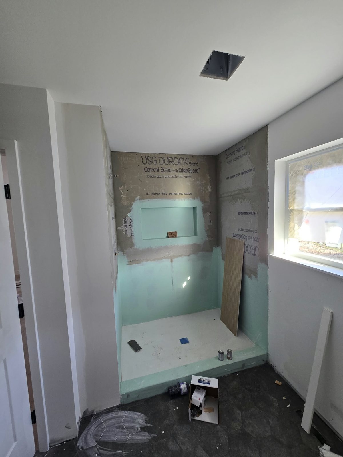 Primary shower framed in cement board and waterproofing before tile
