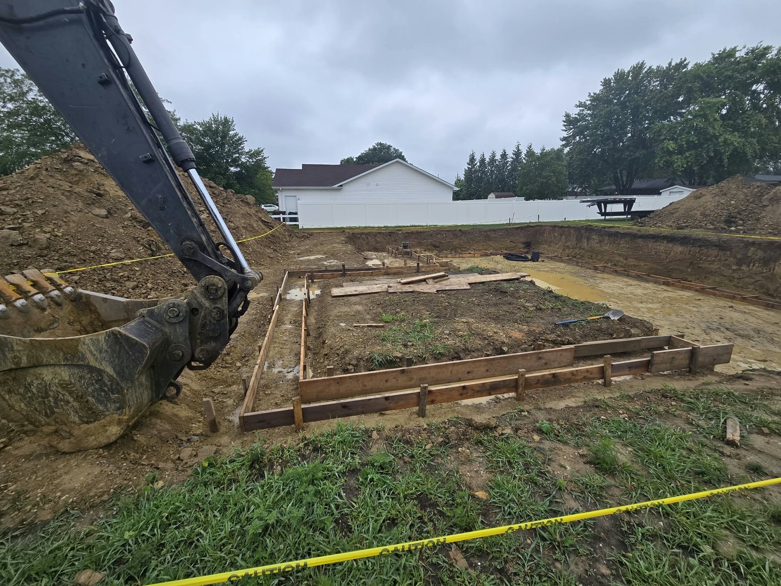 Excavation and footing forms for the basement and garage of a new construction home in Manteno, Illinois