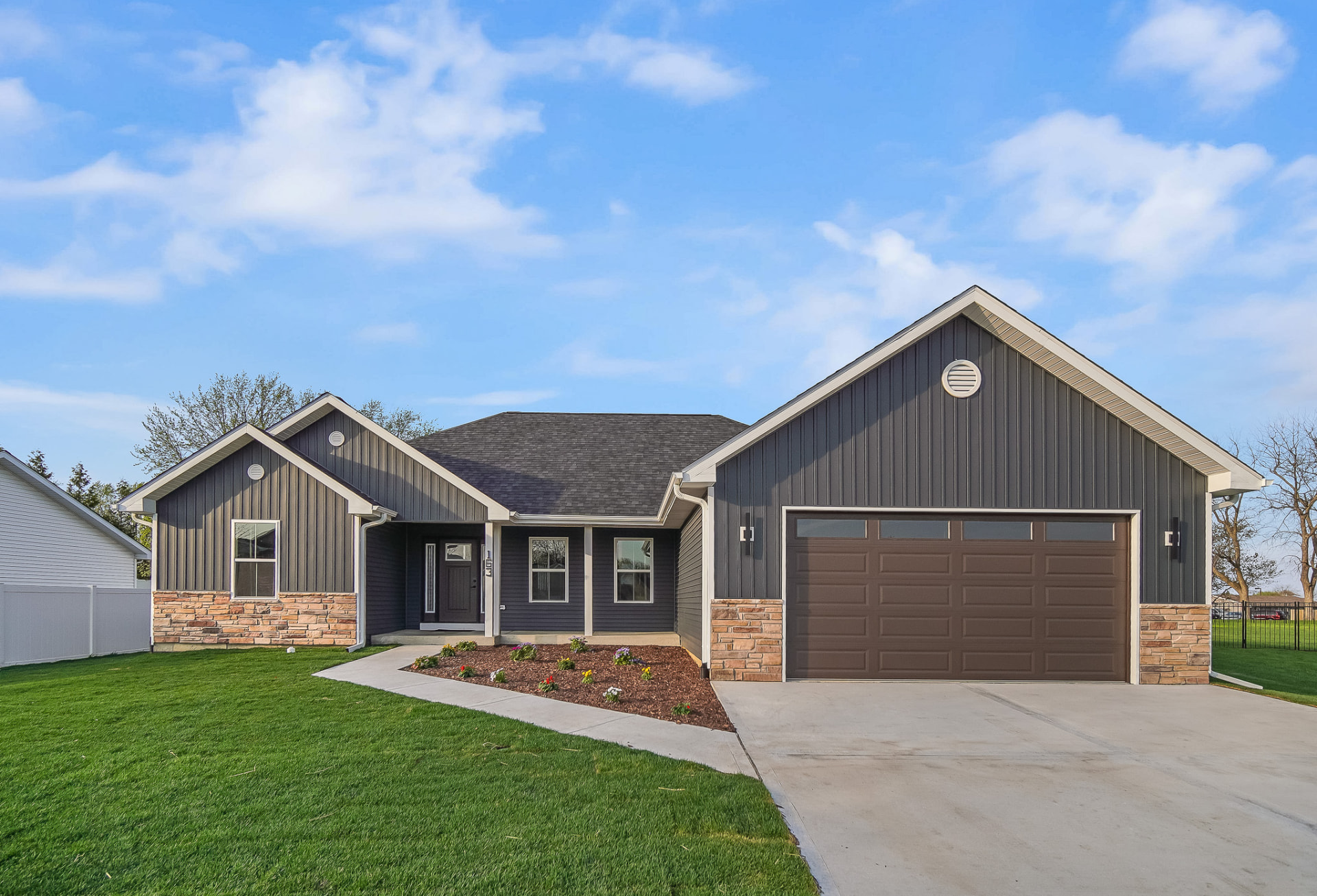 Front exterior of the Manteno spec home in daylight